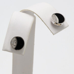 Round onyx and diamond post earrings in white gold with friction back