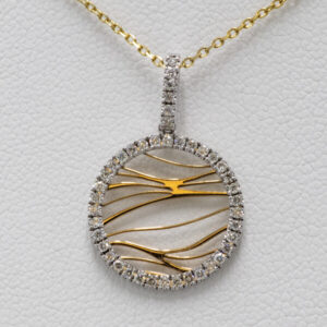 Round diamond and gold pendant