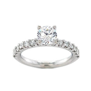 Diamond engagement ring with shared prong diamond melee and a 4 prong center head 