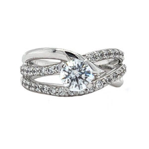 Free form engagement ring with shared prong diamond melee and a 4 prong peg head 