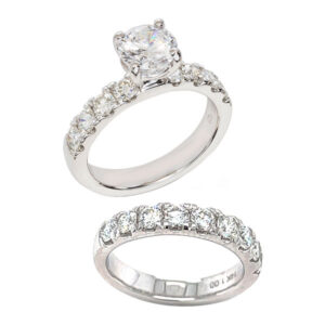 French prong diamond engagement ring .86ct tw of diamond melee and a matching French prong wedding band .99ct tw 