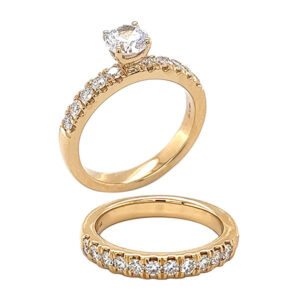 Engagement ring set with brilliant cut French prong set diamonds .40ct tw and a matching French prong diamond wedding band .43ct tw 