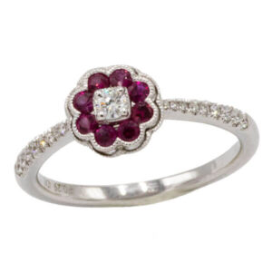 Red ruby & diamond ring in a white gold pave setting