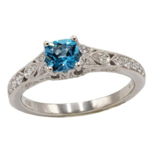 Cushion cut topaz in a vintage style white gold setting