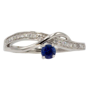 Blue sapphire & channel set diamond ring set in white gold