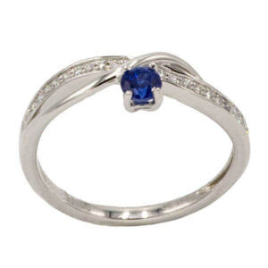 Blue sapphire & channel set diamond ring set in white gold