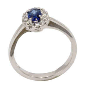 Halo blue sapphire & diamond ring in white gold setting