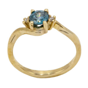 Round cut blue zircon & diamonds in a yellow gold setting