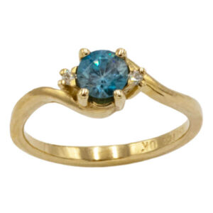 Round cut blue zircon & diamonds in a yellow gold setting