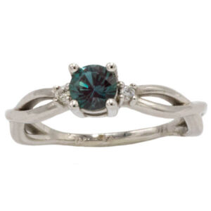 Round cut blue green alexandrite & diamond ring in a white gold setting