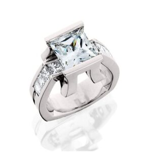 unique Aurum engagement ring set with a half bezel set style center and princess cut diamond melee 